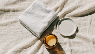Fragrance free skincare basics laid out on cream linen