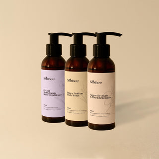 Three bottles of Soothee skincare products on a beige background
